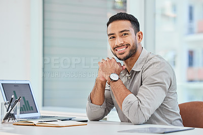 Buy stock photo Shot of a young businessman at work in his office