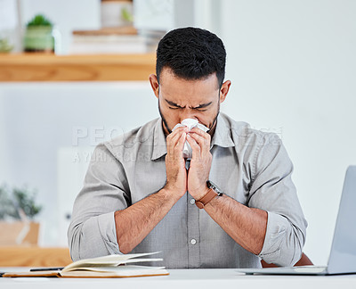 Buy stock photo Man, office and sick with blowing nose on illness, flu and sinus with startup company as interior designer. Employee, sneeze and fever or germs, virus and allergy with tissue at desk and infection