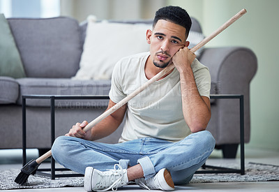 Buy stock photo Portrait, depression and man cleaning home for hygiene, health and wellness in living room. Sad person, housework and tired of chores, stress or frustrated janitor with broom on floor in apartment