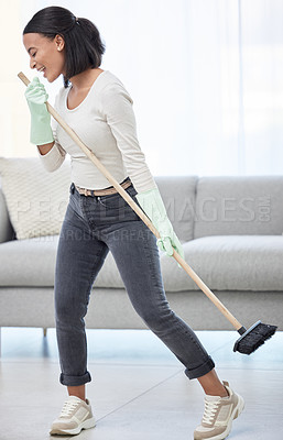 Buy stock photo Singing, dance and woman with broom at home for cleaning, hygiene and weekend routine. Music, sing and female person having fun while sweeping a living room floor, happy and enjoying radio in a house