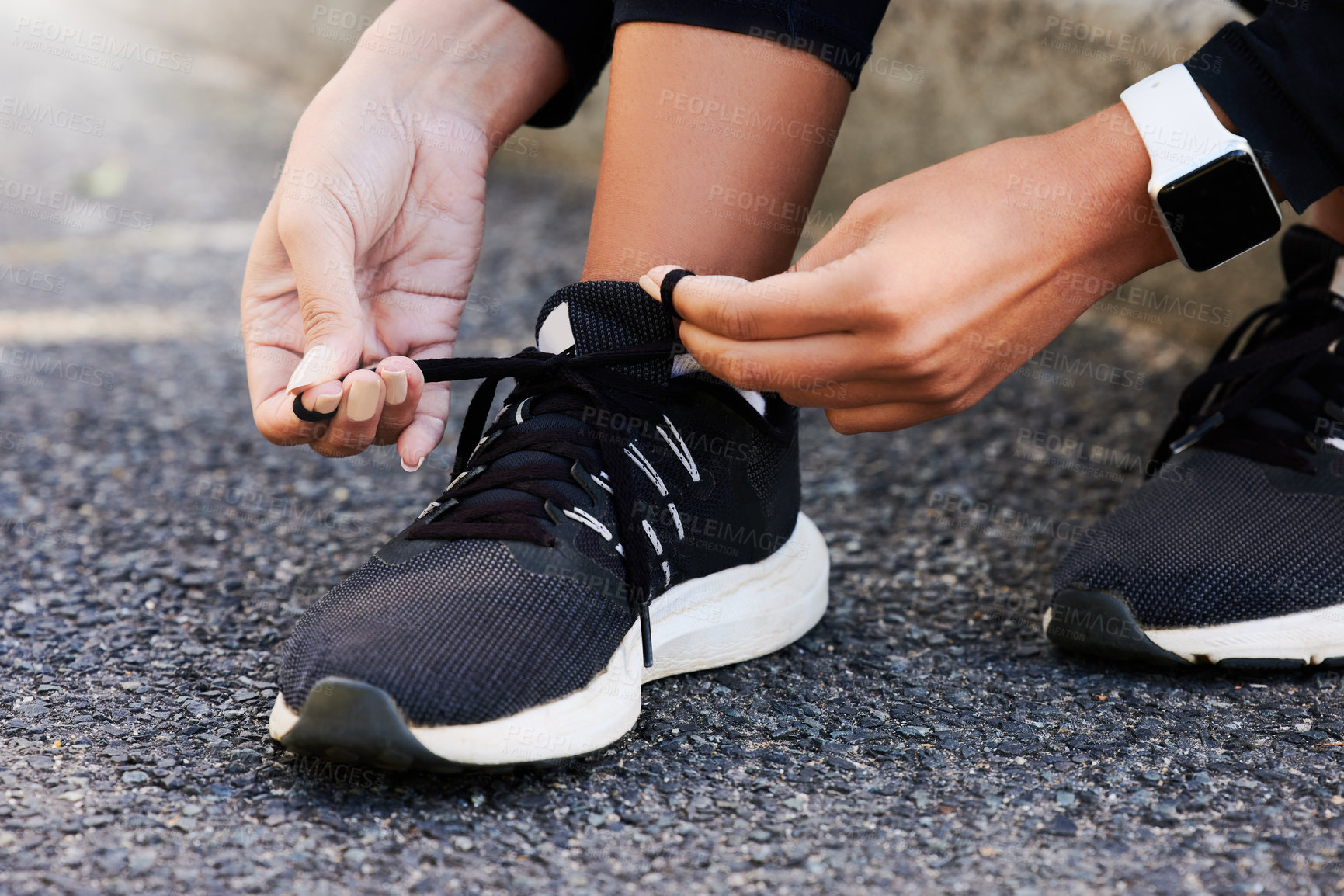 Buy stock photo Fitness, hands and tie shoes on road to start workout, training or exercise legs outdoor. Closeup, runner and tying lace on sneakers at street in preparation for sport, health and wellness of woman