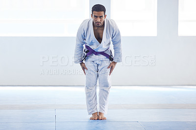 Buy stock photo Man, bow and respect in karate for sport in fitness center for self defense, fighting and discipline. Pro athlete, champion and ready to fight with martial arts, practice and wellness for competition