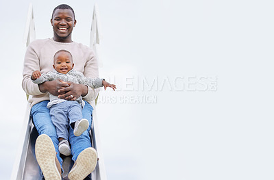 Buy stock photo Father, son and portrait on slide at playground with mock up space, sky and playing for bonding in summer. Man, child and happy black family at park for games, love and vacation with hug for safety