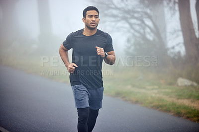 Buy stock photo Man, fitness and running on road in nature for cardio workout, exercise or training outdoors. Fit, active or athlete male person or runner exercising on street asphalt in run for healthy wellness