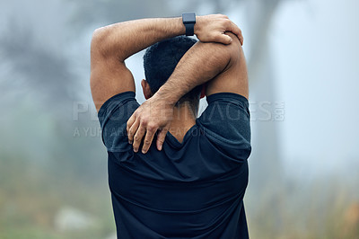 Buy stock photo Fitness, back and man stretching arms for exercise, workout or training in the nature outdoors. Rear view of fit and active male person or runner in warm up stretch for running or cardio exercising
