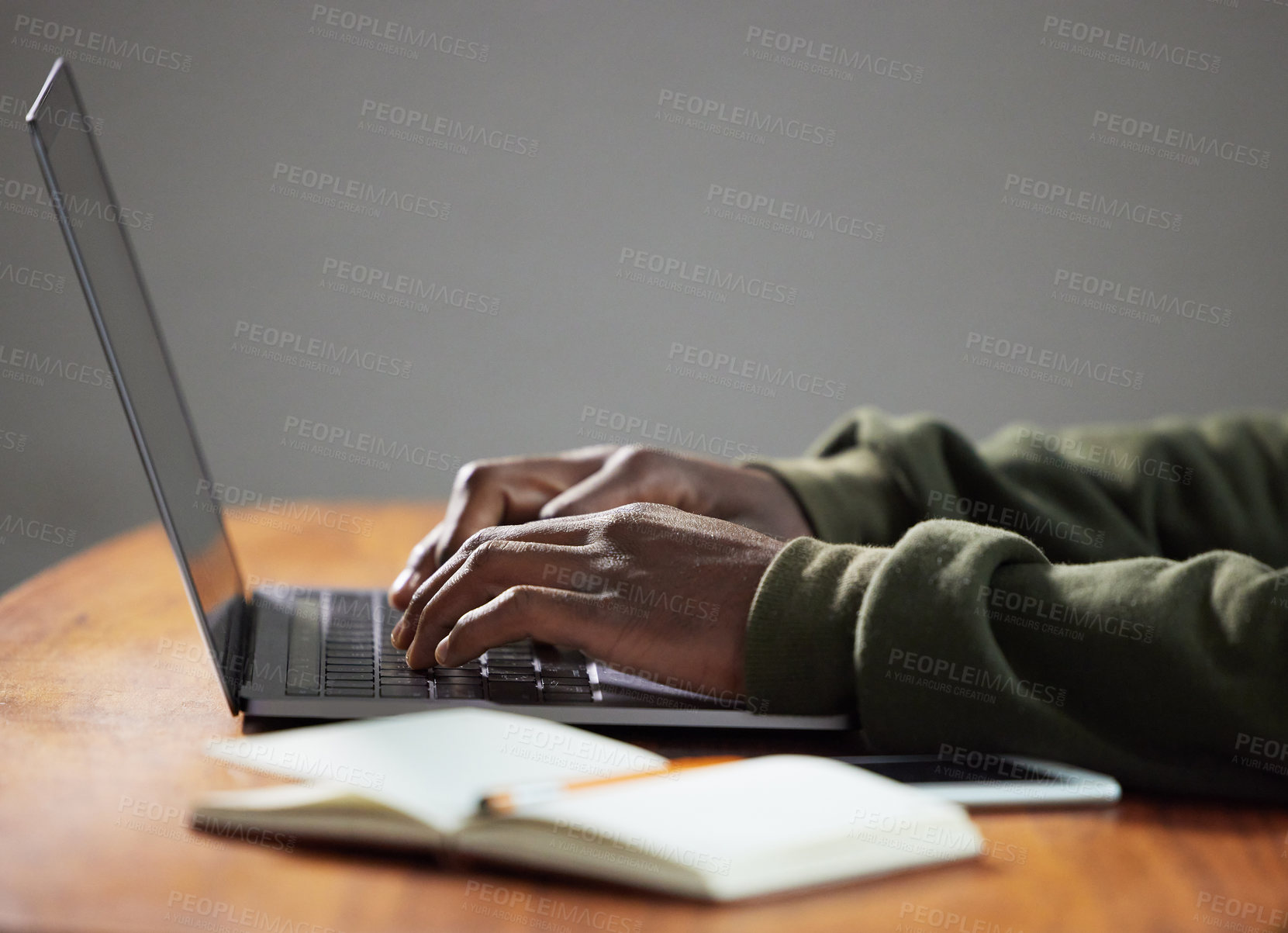 Buy stock photo Shot of an unrecognizable person using a laptop in an office