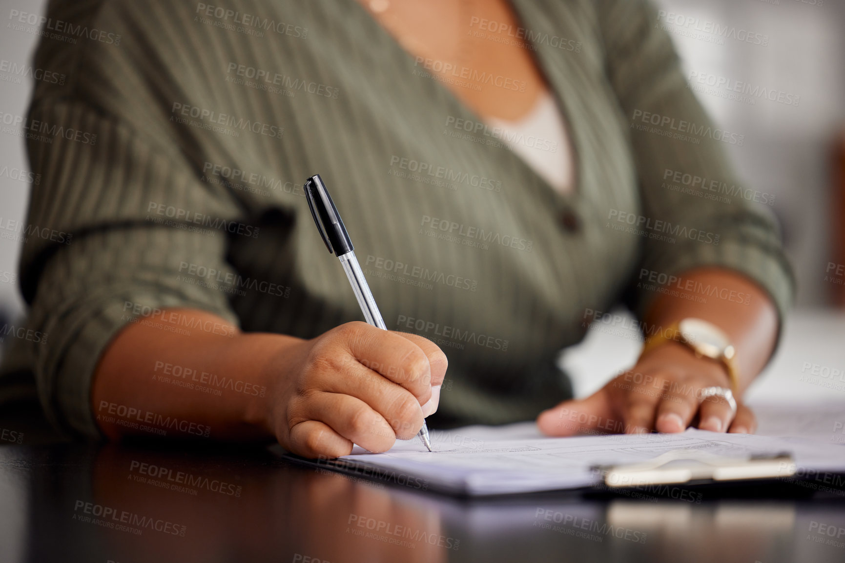 Buy stock photo Unrecognizable shot of a woman doing some paperwork at home