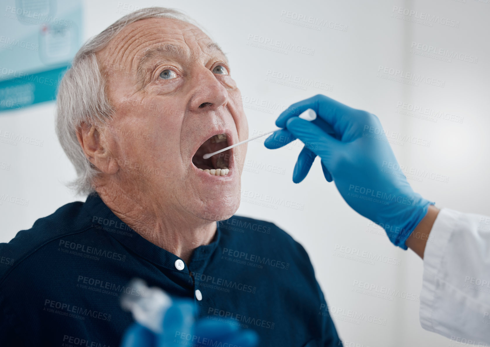 Buy stock photo Cropped shot of an unrecognizable doctor testing a senior male patient for covid
