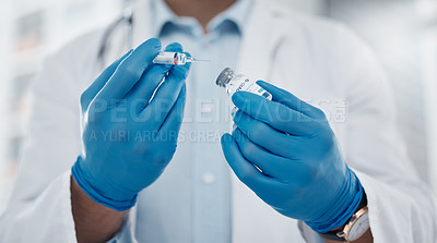 Buy stock photo Cropped shot of an unrecognizable male doctor preparing the covid 19 vaccination for a patient