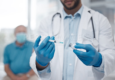 Buy stock photo Cropped shot of an unrecognizable male doctor preparing the covid 19 vaccination for a patient