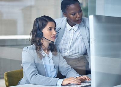 Buy stock photo Cropped shot of an attractive young female call center floor manager supervising her staff in the office