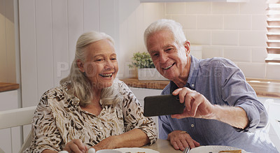 Buy stock photo Mature couple, happy and selfie in kitchen at home with smile, retirement or bonding in marriage. Morning, photography and social media for profile picture, image post or elderly people with joy
