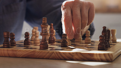 Buy stock photo Game, hand and choice in chess, table and board of wood, strategy and challenge for person, house and relax. Home, problem solving and contest or hobby, skill and brain for competition in weekend