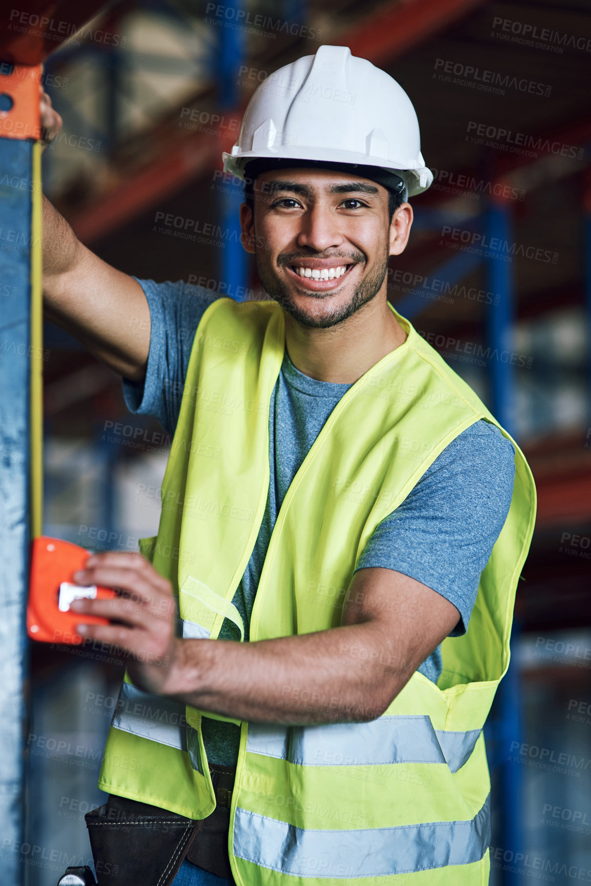 Buy stock photo Warehouse, portrait and man with tape measure for construction, building accuracy and dimensions. Architecture, engineer and happy person with measurement for installation, scaffolding and inspection