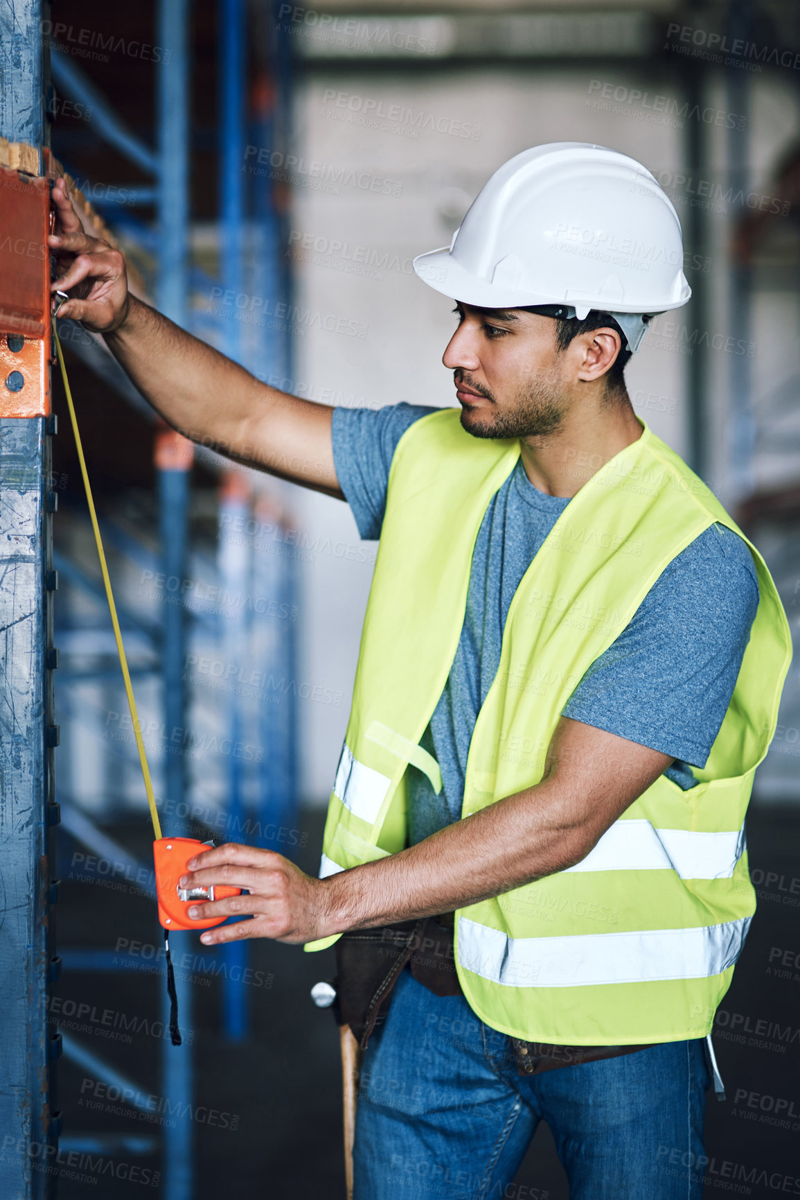 Buy stock photo Warehouse, inspection and man with tape measure for construction, building accuracy and dimensions. Architecture, engineer and person with measurement for installation, scaffolding and renovation