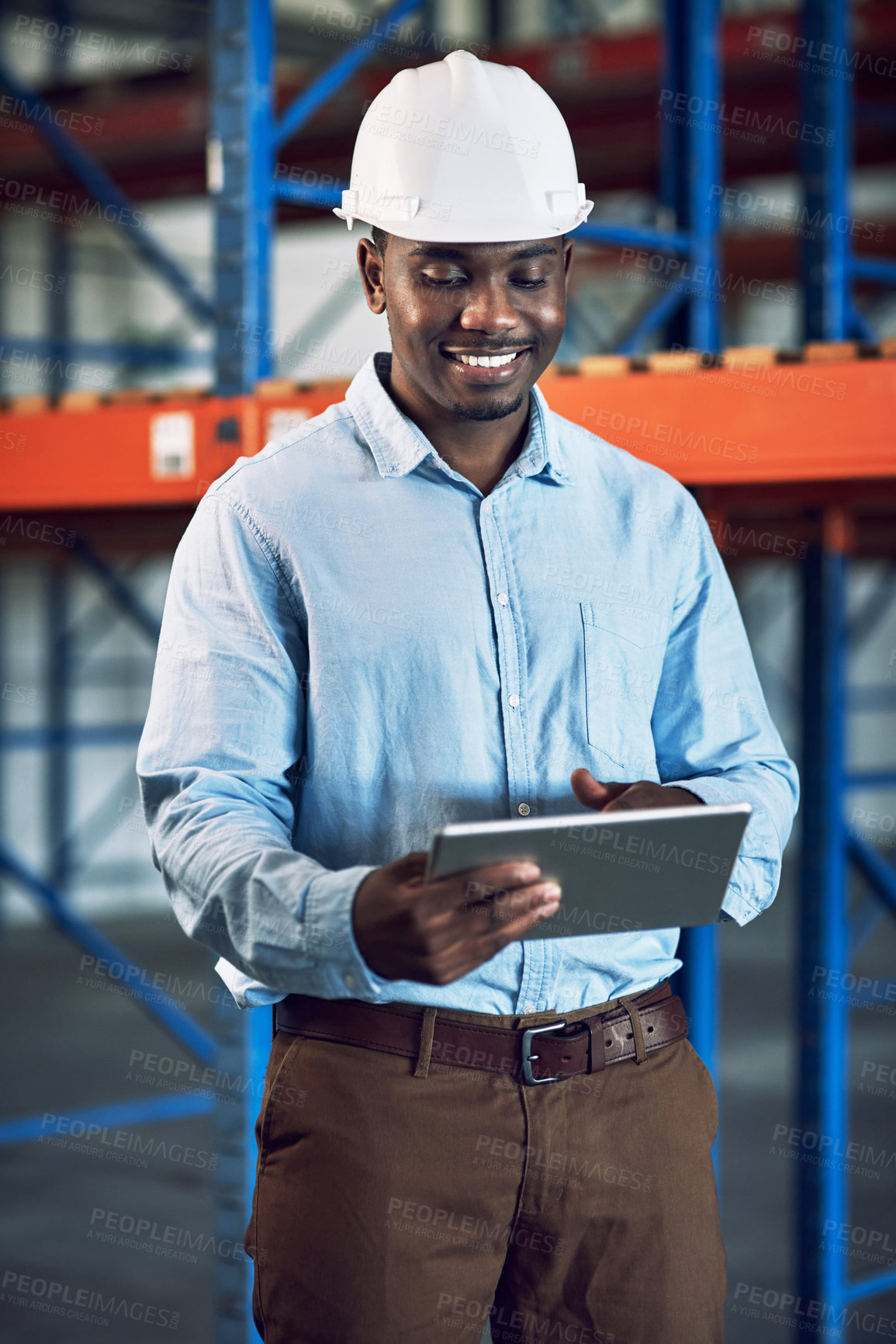 Buy stock photo Shot of a builder using a digital tablet while working at a construction site