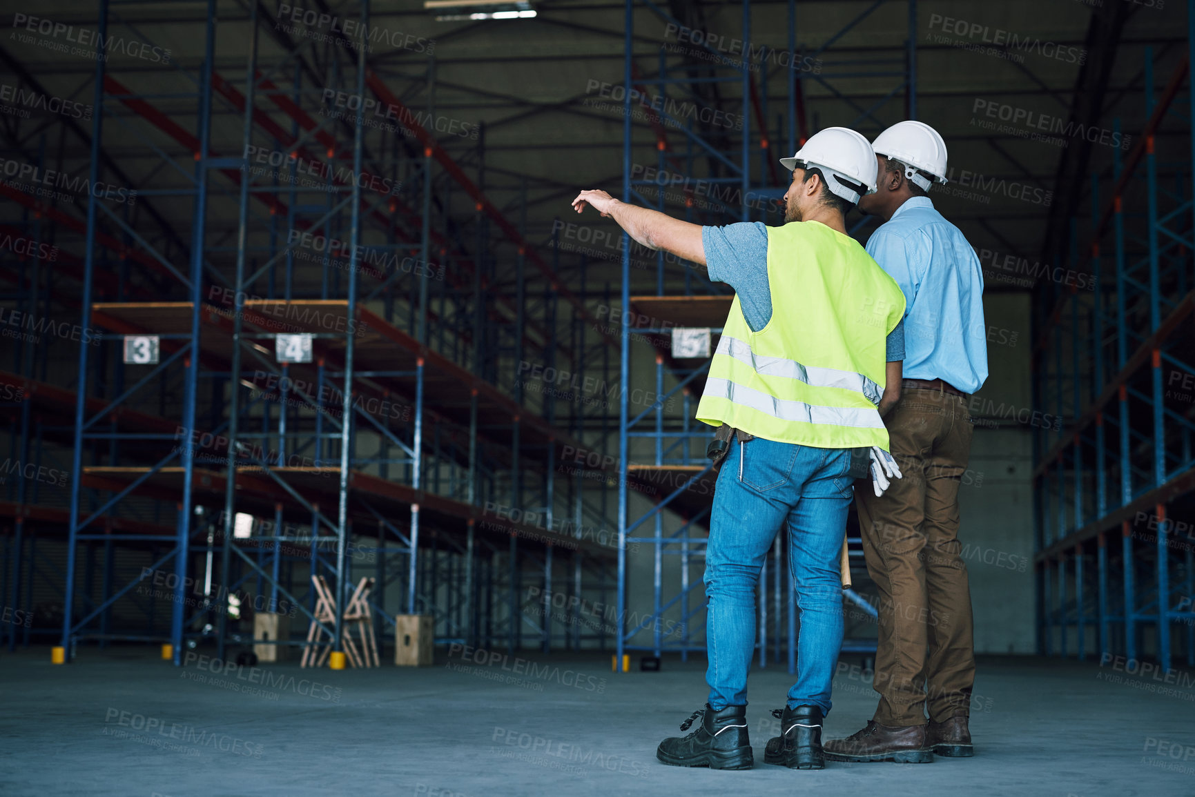 Buy stock photo Shot of two builders inspecting a construction site