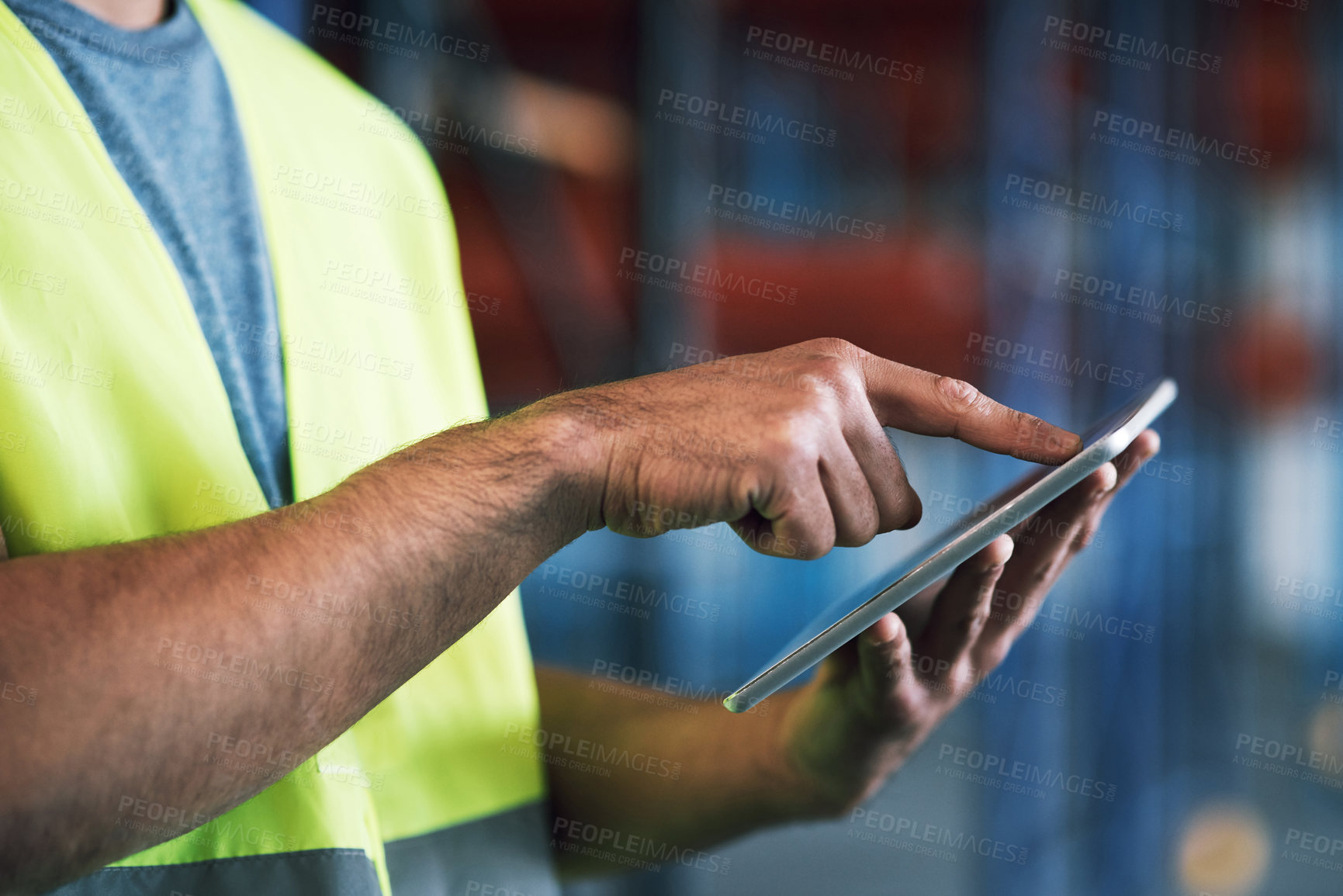 Buy stock photo Shot of a builder using a digital tablet while working at a construction site