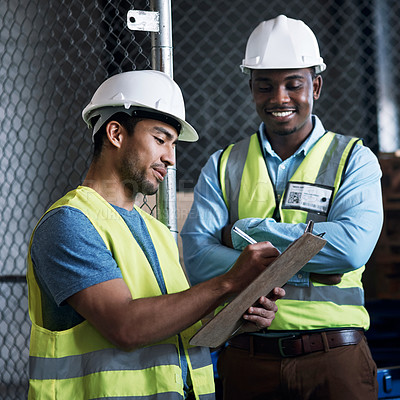 Buy stock photo Shot of two builders inspecting a construction site
