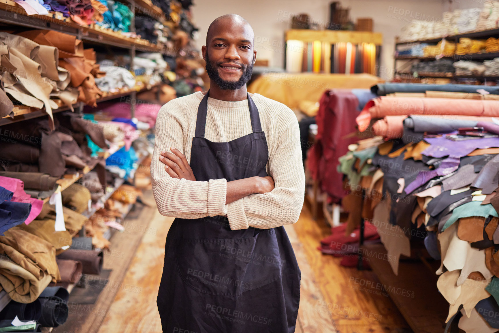 Buy stock photo Shot of a young man working at his job in a shop