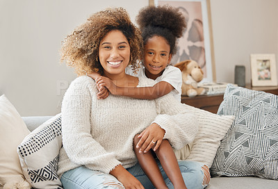 Buy stock photo Smile, hug and portrait of mother with child on sofa for mothers day love, bonding and care at home. Happy, family and girl kid embracing mom with relaxing in living room together at house in Mexico.