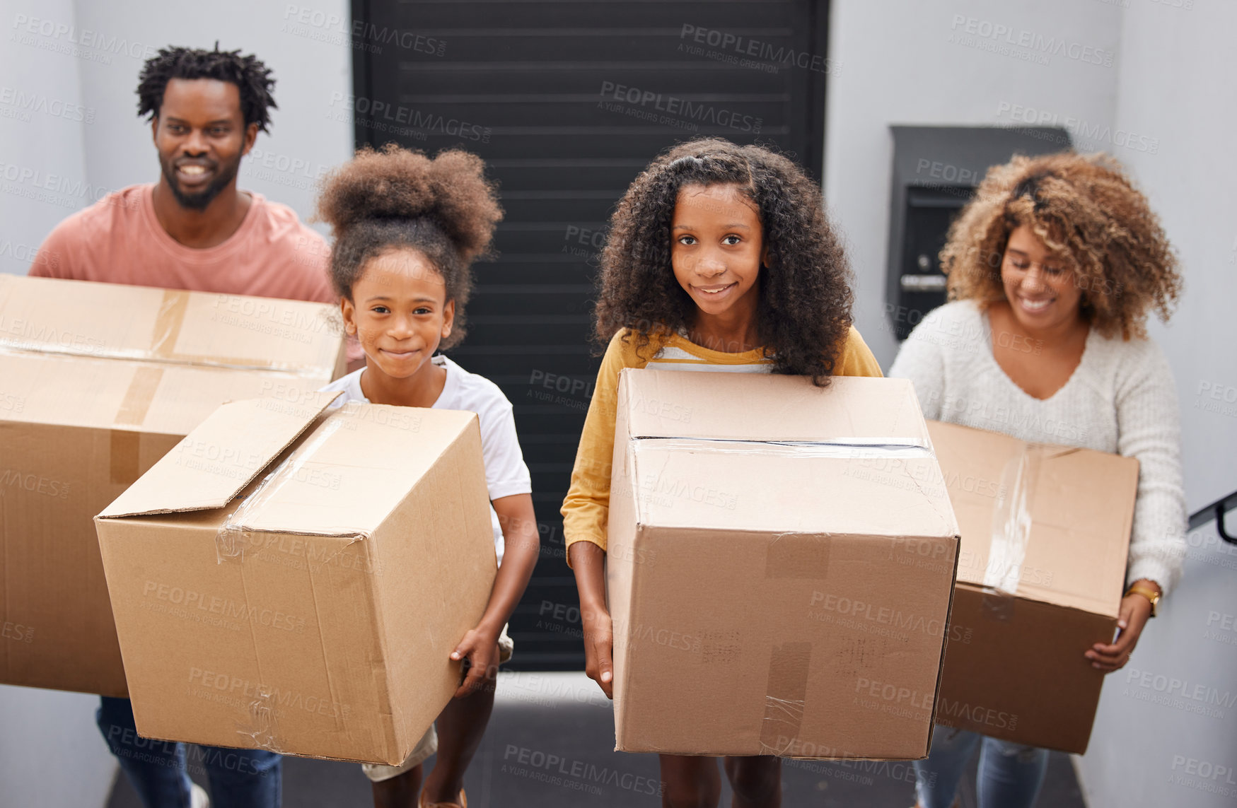 Buy stock photo Happy, family and moving with boxes in house for real estate, walking or together or helping. Group, people and new home with investment or growth for children, welcome or property with mortgage