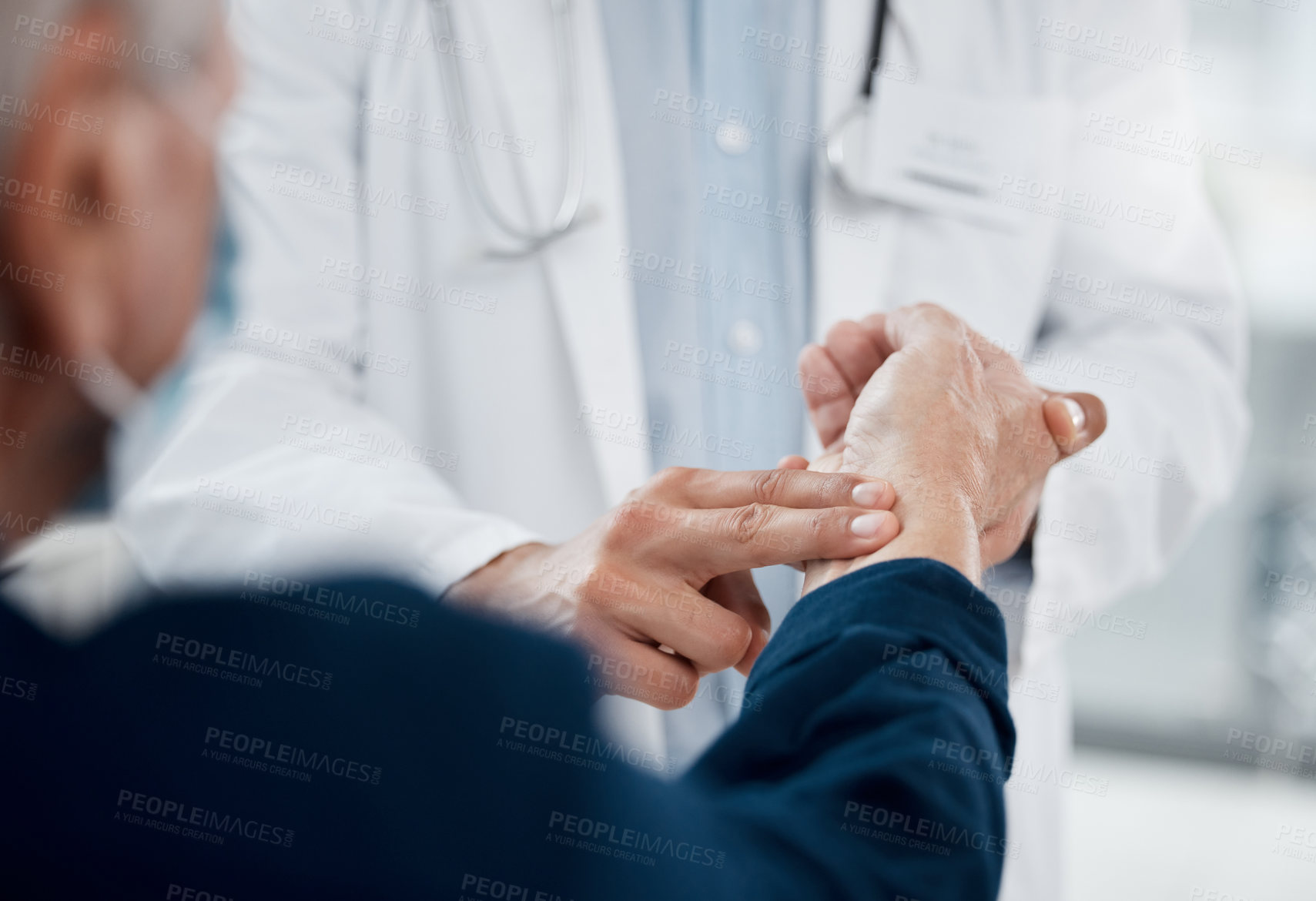 Buy stock photo Shot of an unrecognizable doctor checking a patient's pulse in an office