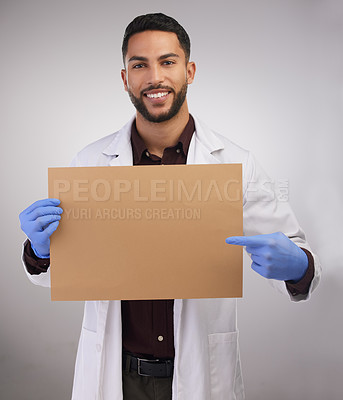 Buy stock photo Portrait, happy man and doctor pointing at poster for healthcare, advertising or mockup isolated on white studio background. Scientist, sign and medical professional on board to show blank space