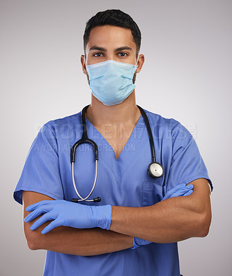 Buy stock photo Studio, man or nurse in portrait with mask, professional and arms crossed or pride by white background. Male surgeon, face cover and gloves for bacteria, virus and illness protection with regulations