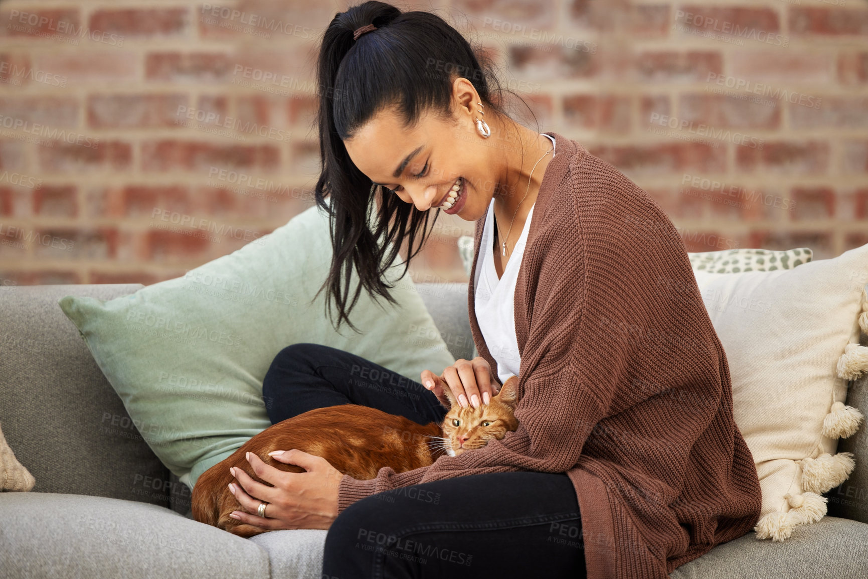 Buy stock photo Love, woman with her cat and on a sofa in living room of her home sitting. Animal care or support, quality or bonding time and happy female person pet her kitten on a couch together at her house