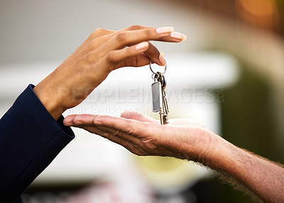 Buy stock photo Cropped shot of an unrecognizable female real estate agent handing the keys of a newly purchased home to her male client outside
