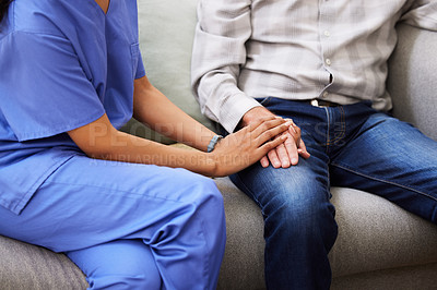 Buy stock photo Shot of a nurse holding the hand of her [patient in support