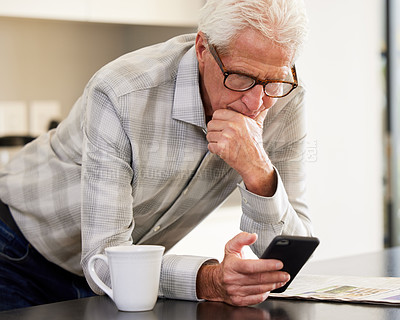 Buy stock photo Shot of a mature man using his smartphone to send a text