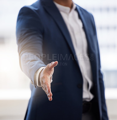 Buy stock photo Cropped shot of a businessman holding his hand out for a handshake