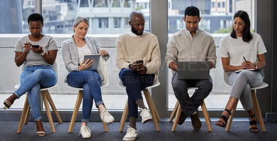 Buy stock photo Business people, row and waiting room with technology for interview, career news or job opportunity at office. Young group of employees in line with laptop, tablet or phone for research or networking