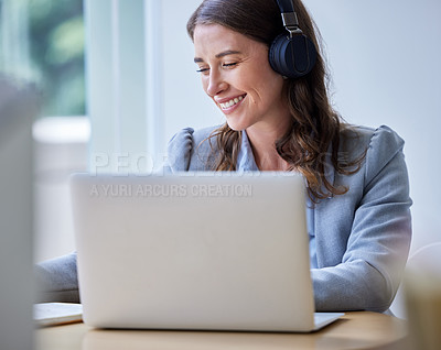 Buy stock photo Shot of a businesswoman using her laptop at work