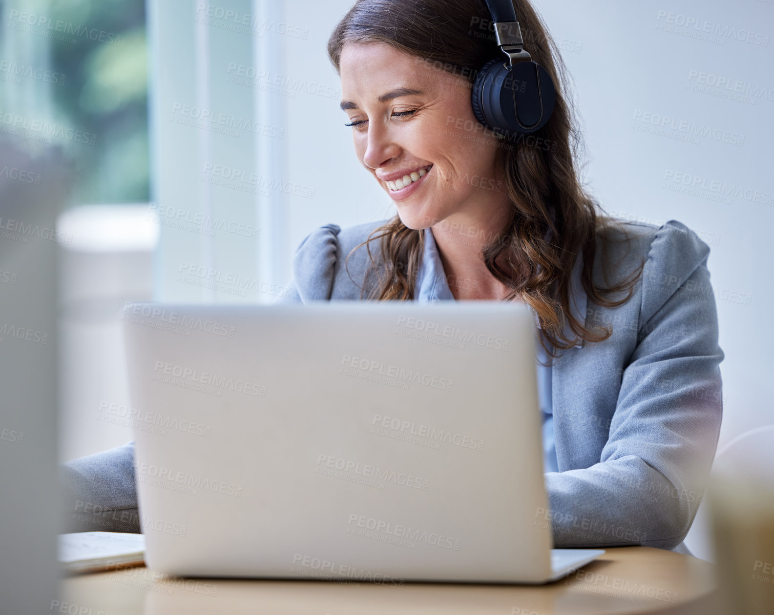 Buy stock photo Startup, smile and woman with laptop, headphones and confidence in office, digital and technical writer. Proud, person and employee in workplace, computer and happy for project, editor and website