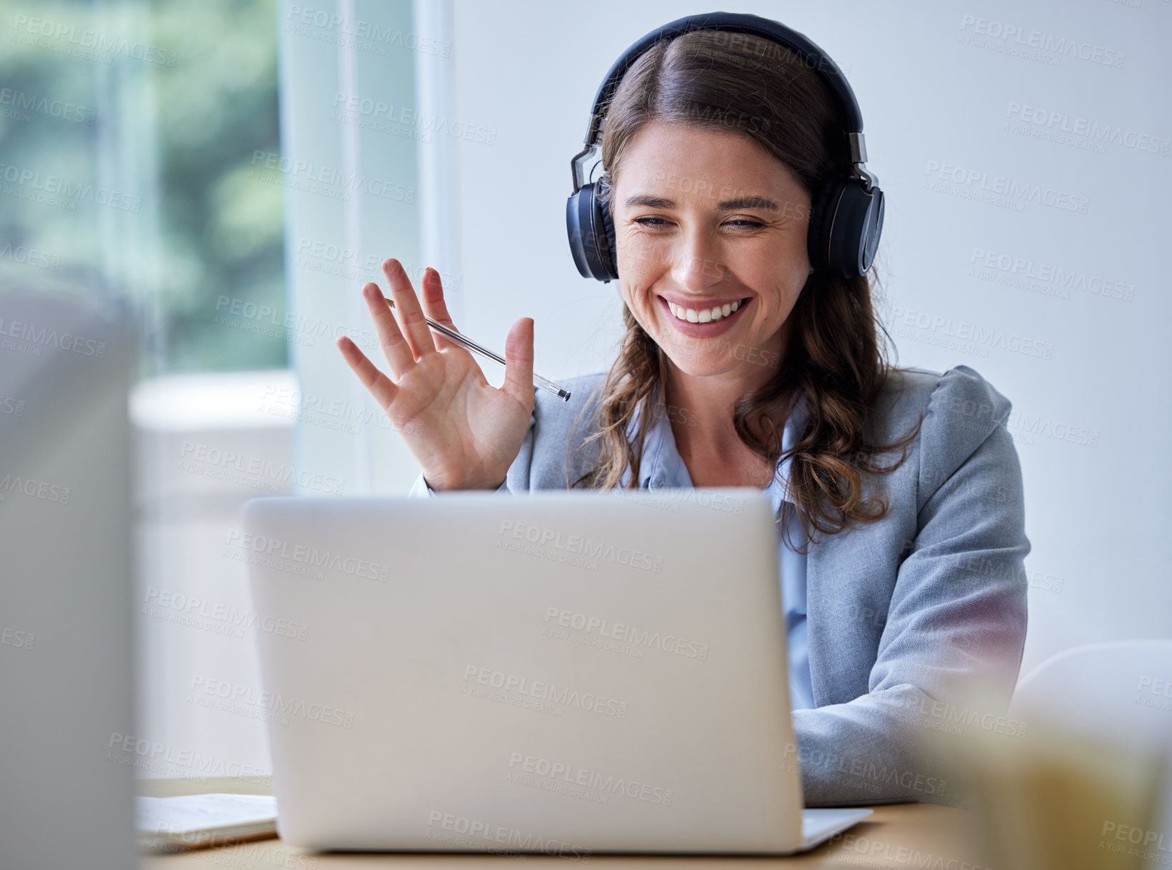 Buy stock photo Businesswoman, laptop and smile in video conference call or online meeting in home office for project. Female person, professional and wave with hand gesture in greeting on tech with headphones