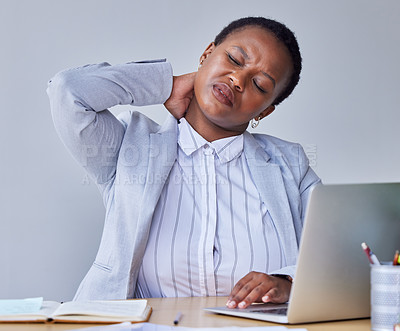 Buy stock photo Shot of a businesswoman experiencing neck cramps at work
