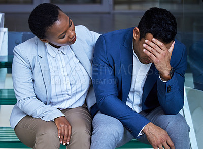 Buy stock photo Shot of a young woman comforting her colleague at work