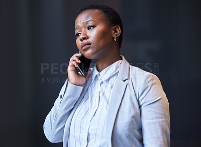 Buy stock photo Shot of a young woman using her phone at work
