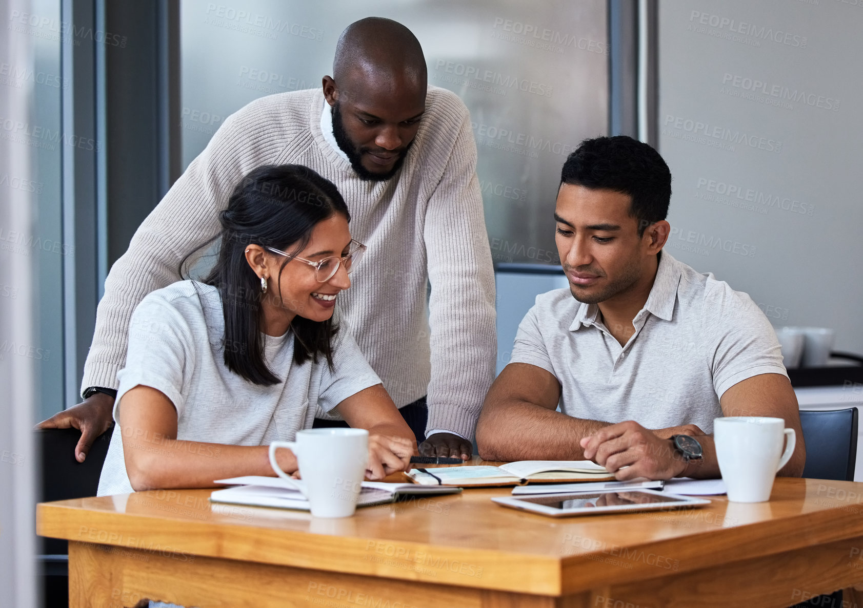 Buy stock photo Business people, meeting and table with book in office for communication, feedback and teamwork. Journalist, diversity and employees with discussion for article, brainstorming and planning together