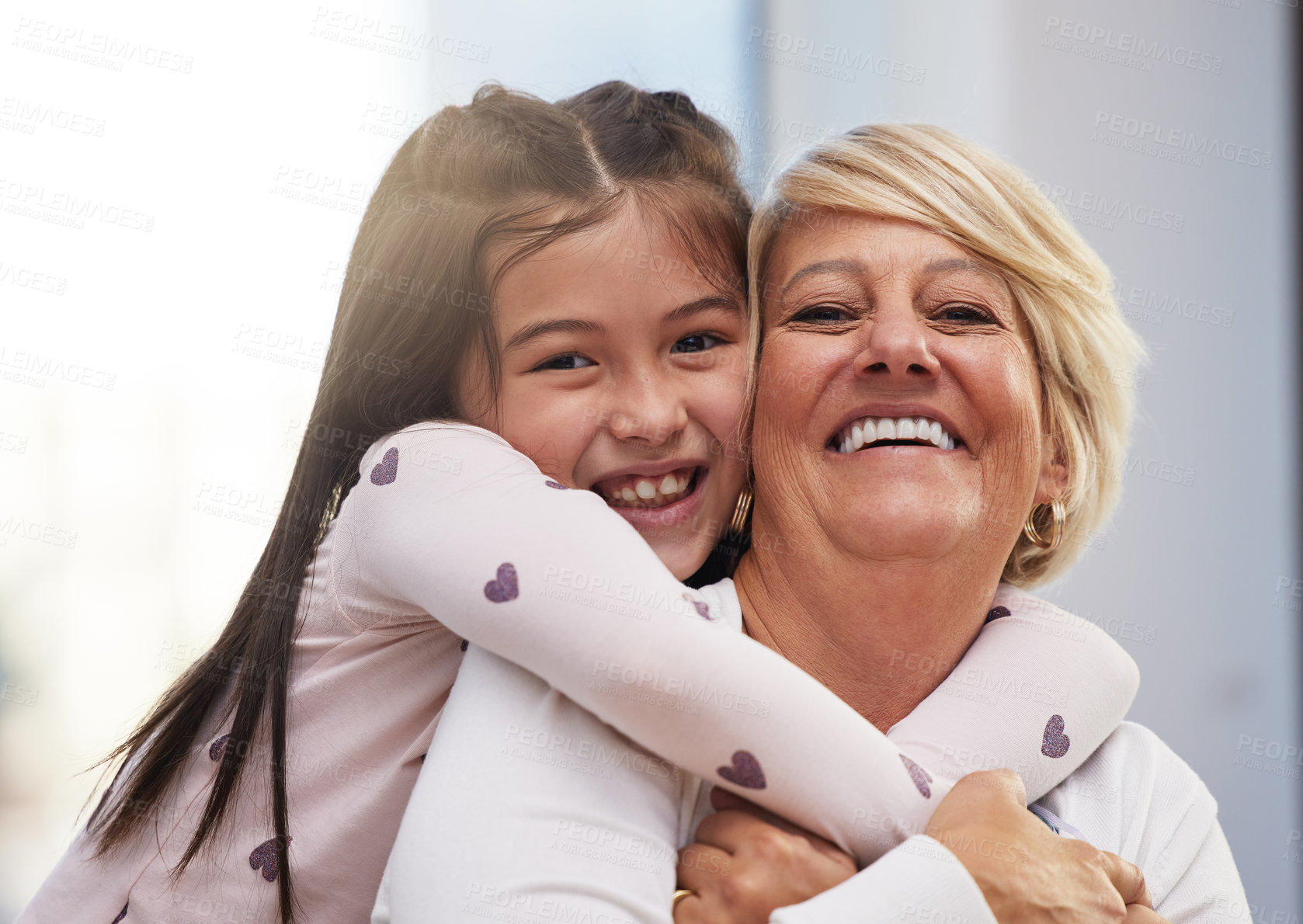 Buy stock photo Portrait, hugging and child with mother in home for laughing, bonding and love together in living room. Smile, happy and mom embracing girl kid with care on sofa in lounge together at family house