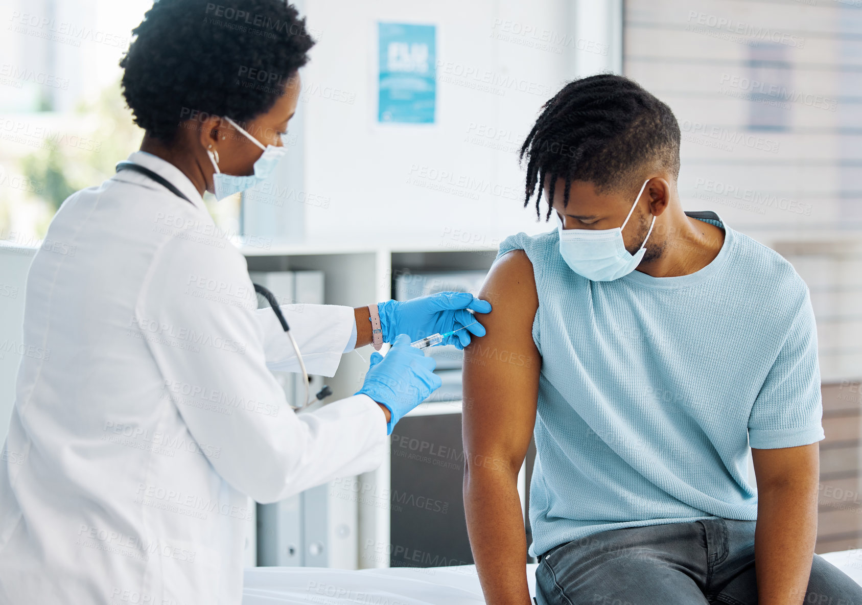 Buy stock photo Shot of a doctor giving her patient an injection