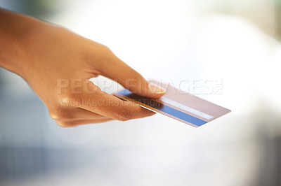 Buy stock photo Shot of an unrecognizable person holding a credit card