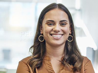 Buy stock photo Cropped portrait of an attractive young businesswoman standing in her office