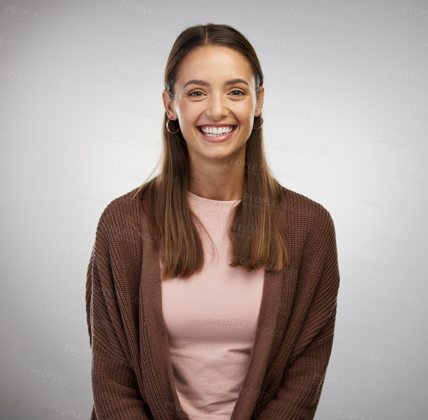 Buy stock photo Studio shot of a beautiful young woman posing against a grey background