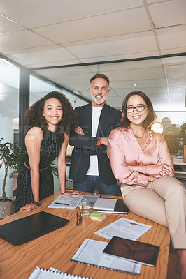 Buy stock photo Shot of a diverse group of businesspeople standing together in the office during a meeting