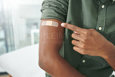 Buy stock photo Shot of an unrecognizable person's arm with a band-aid