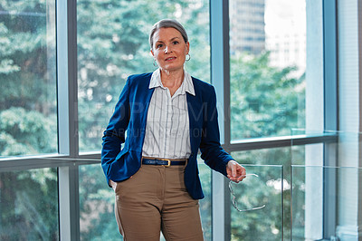 Buy stock photo Mature, portrait and woman in office building for business career, professional and positive mindset with ambition. Female entrepreneur or ceo of legal agency, affirmative action and corporate boss.